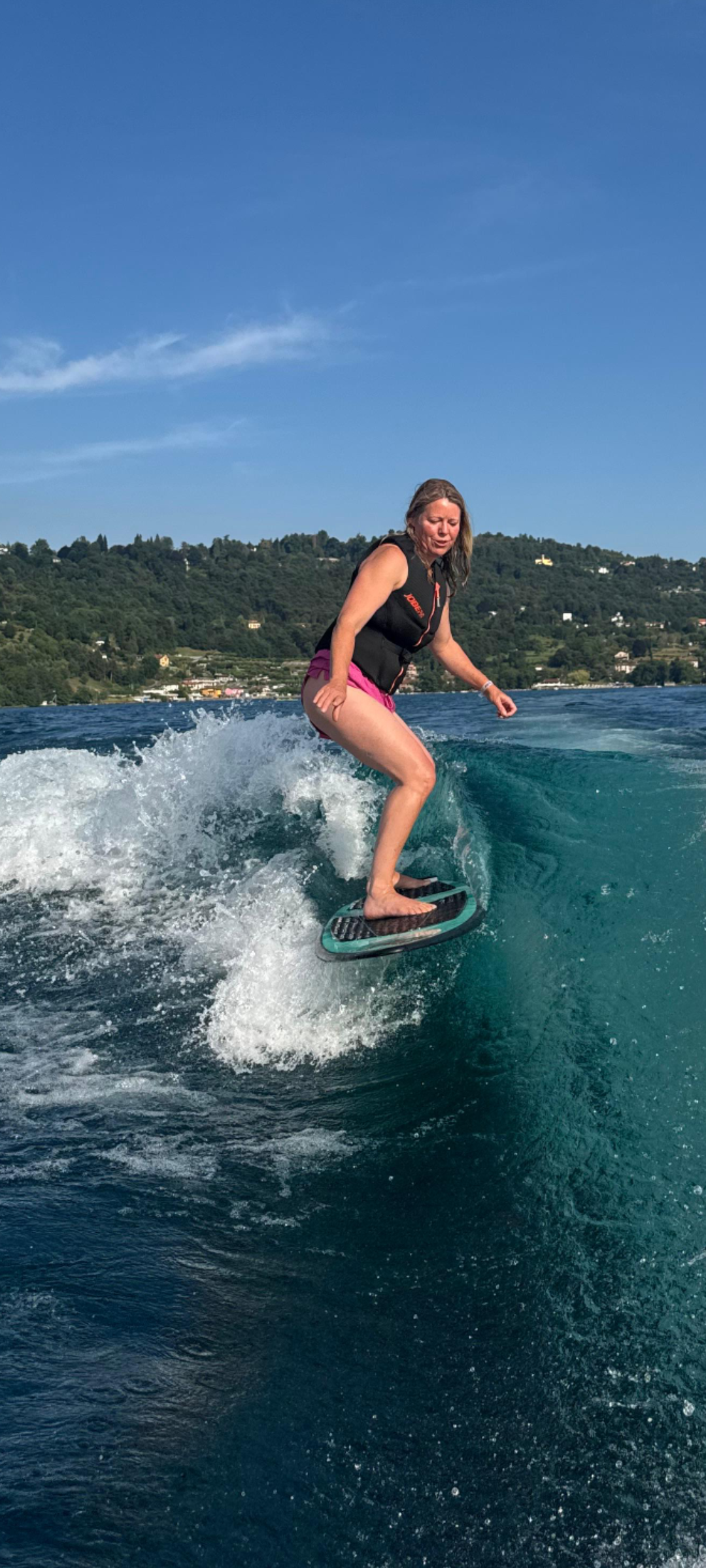 Leonoor Ruigrok wake surfing at Lake Orta. Wake and landscape